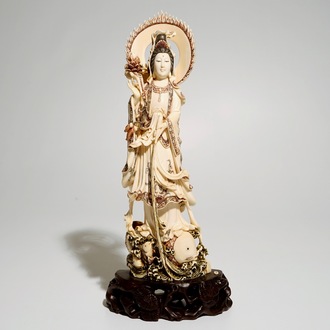 A Japanese ivory model of Guanyin on a carp, Taisho, ca. 1930, signed