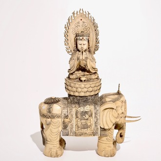 A large Chinese ivory group of Guanyin seated on an elephant, late 19th C.