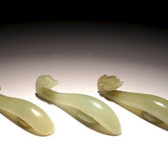 Three Chinese celadon jade belt hooks, 19/20th C.