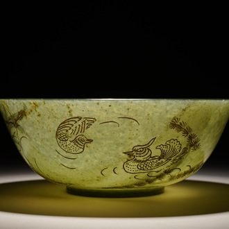 A Chinese spinach green jade engraved and gilt bowl, 19/20th C.