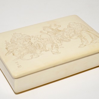 A signed Japanese rectangular carved ivory box and cover, Meiji, 19th C.