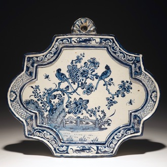 A Dutch Delft blue and white plaque with birds among flowers, 18th C.