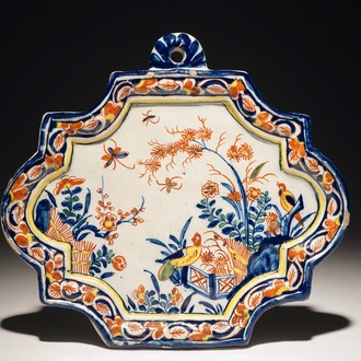 A Dutch Delft polychrome plaque with birds and insects among flowers, 18th C.