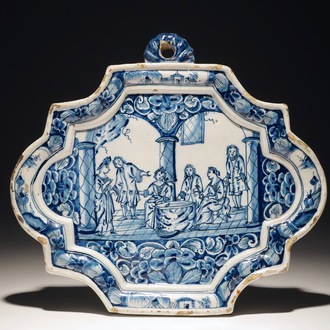 A Dutch Delft blue and white plaque with a tasting scene, 18th C.