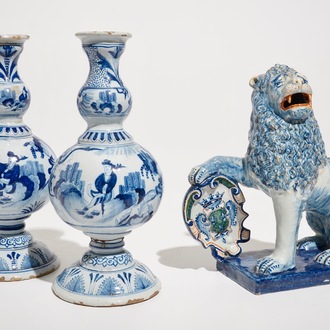 A pair of Delft style blue and white chinoiserie vases and a model of a lion with a shield, France, 19th C.