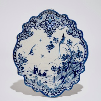 A Dutch Delft blue and white chinoiserie plaque with figures in a boat, 1st half 18th C.