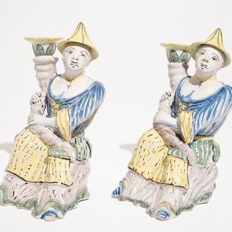 A pair of polychrome Brussels faience candlesticks modelled as chinamen, ca. 1800