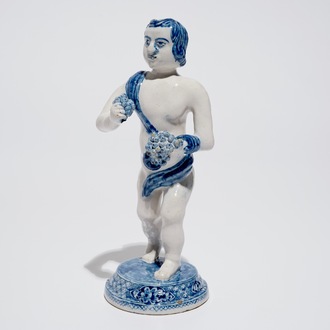 A Dutch Delft blue and white model of Bacchus, early 18th C.