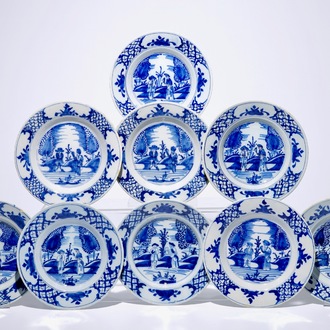 A set of nine Dutch Delft blue and white plates with a couple in a landscape, 18th C.