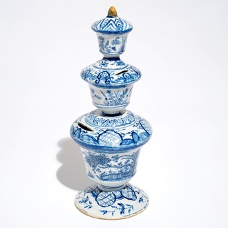 A large Dutch Delft blue and white money bank with polychrome finial, 1st half 18th C.