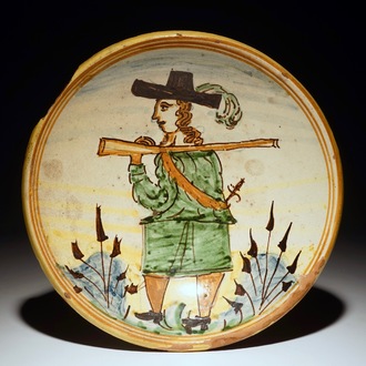 A polychrome Italian maiolica dish with a soldier, prob. Montelupo, 17/18th C.