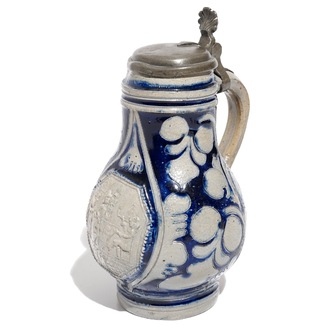 A Westerwald stoneware pewter-mounted jug with a tavern scene, 17th C.