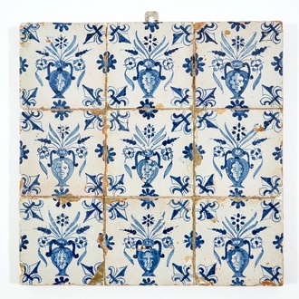 A field of 9 Dutch Delft blue and white tiles with masked flower vases, 1st half 17th C.