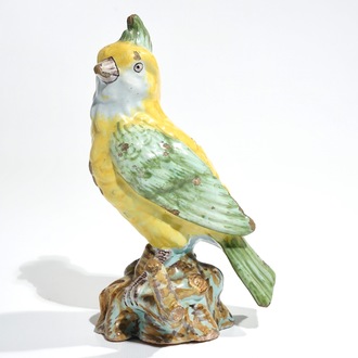 A polychrome Dutch Delft or French faience model of a bird, 18/19th C.