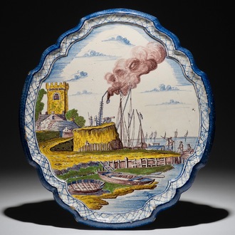 A Frisian Dutch Delftware plaque with a harbor view, Makkum, 19th C.