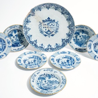 Seven Dutch Delft blue and white plates and a large armorial dish, 17/18th C.