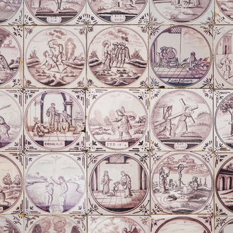 A field of 49 Dutch Delft manganese tiles with religious scenes in central medallions, 18/19th C.