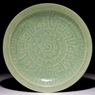 A Chinese celadon dish with incised lotus design, 18/19th C.