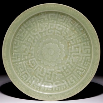 A Chinese celadon dish with incised lotus design, 18/19th C.