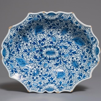 A Dutch Delft blue and white salad bowl with lotus scrolls, 18th C.