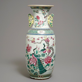 A large Chinese famille rose vase with peacocks and antiquities, 19th C.
