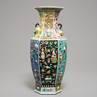 A hexagonal Chinese famille rose vase with applied design, 19th C.