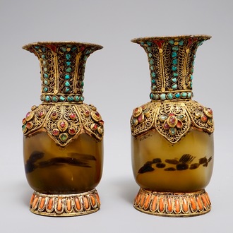 A pair of Tibetan agate flasks with turquoise- and coral-inlaid gilt silver mounts, 19th C.