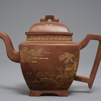 A Chinese Yixing teapot and cover with applied design, 20th C.