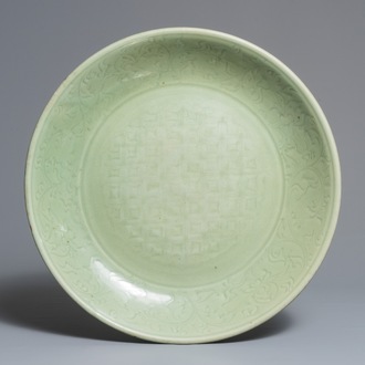 A massive Chinese Longquan celadon dish with underglaze design, Ming