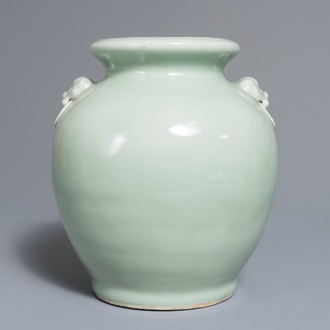 A Chinese monochrome celadon vase with lion head handles, 19th C.