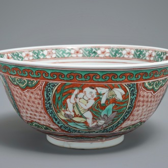 A Chinese wucai bowl with boys holding lotus flowers, Transitional period