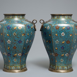 A pair of Chinese cloisonné vases with floral design and ring handles, 19th C.