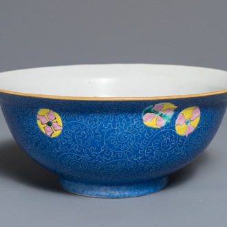 A Chinese famille rose blue ground sgraffiato bowl, Qianlong mark, 19th C.