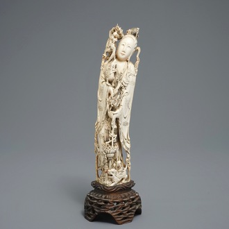 A Chinese carved ivory figure of an immortal with mythical beasts, 19th C.