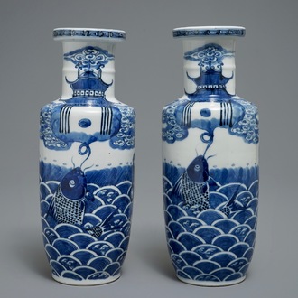 A pair of Chinese blue and white rouleau vases with carps, Kangxi mark, 19th C.