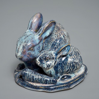 A Chinese Shiwan flambé group of two rabbits, 1st half 20th C.
