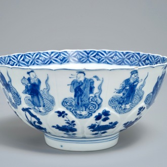 A Chinese blue and white moulded bowl with immortals, Chenghua mark, Kangxi