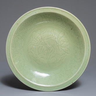 A Chinese Longquan celadon charger with underglaze floral design, Ming