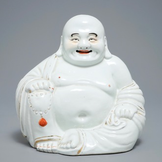 A large Chinese white, iron red and gilt porcelain figure of Buddha, 19/20th C.