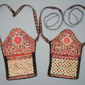 A pair of Chinese embroidered baby carriers, Miao minority, Southern China, early 20th C.