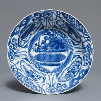 A Chinese blue and white kraak porcelain klapmuts bowl with a flower basket, Wanli