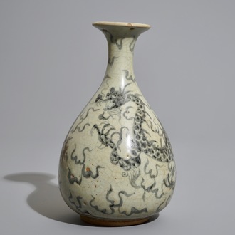 A Thai Sawankhalok blue and white bottle-shaped dragon vase, 17th C.