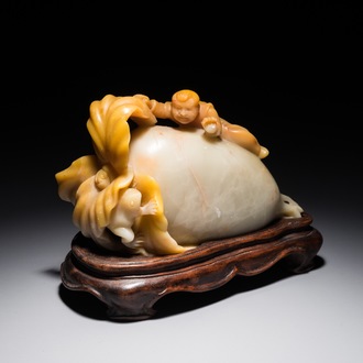 A Chinese jade group of a raphanus with a playing boy and frog, 19/20th C.