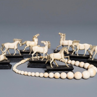 Eight Chinese carved ivory horses on stands and a necklace, 19/20th C.