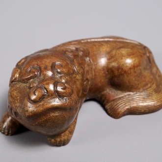 A Chinese bronze scroll or paper weight shaped as a Buddhist lion or Shishi, 18/19th C.