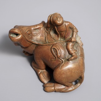 A Chinese bronze water dropper shaped as a boy on a buffalo, 18/19th C.