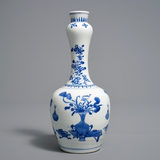 A Chinese blue and white bottle vase with 'antiquities' design, Kangxi