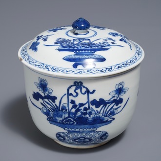 A Chinese blue and white bowl and cover with flower baskets, Kangxi