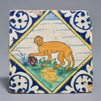 A polychrome Dutch Delft maiolica tile with a monkey, 16/17th C.