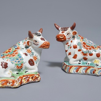 A pair of polychrome Dutch Delft petit feu cows on bases, 18th C.